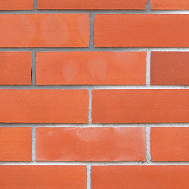 Close up of brick masonry pressure washed before and after